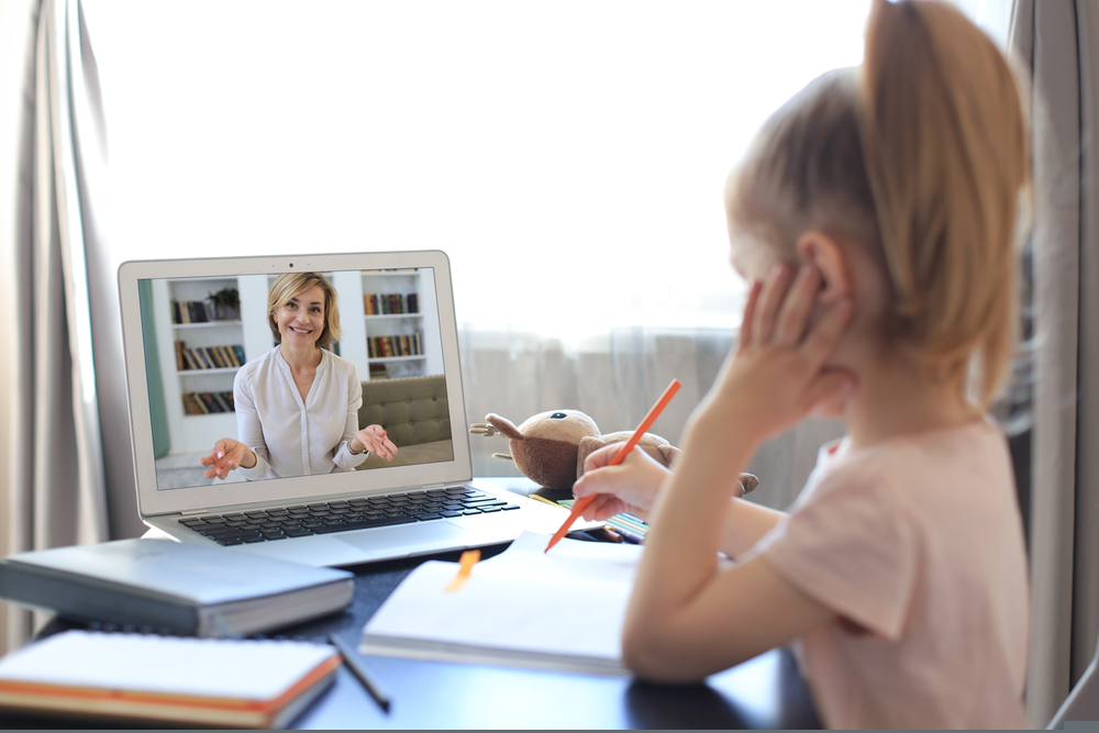 Distance,Learning.,Cheerful,Little,Girl,Using,Laptop,Computer,Studying,Through