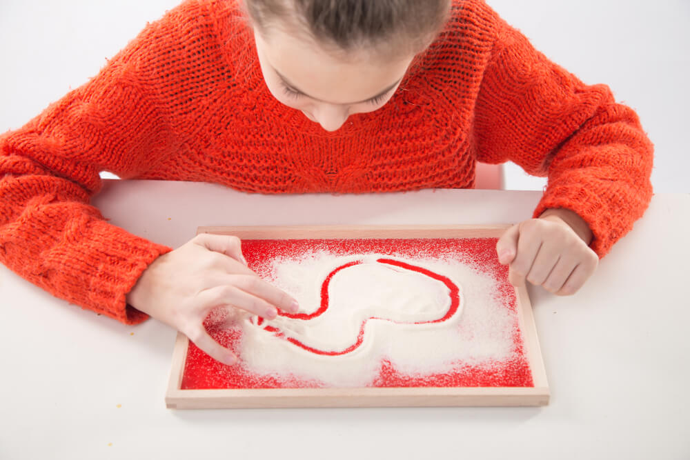 Teach-kids-alphabet-write-in-sand